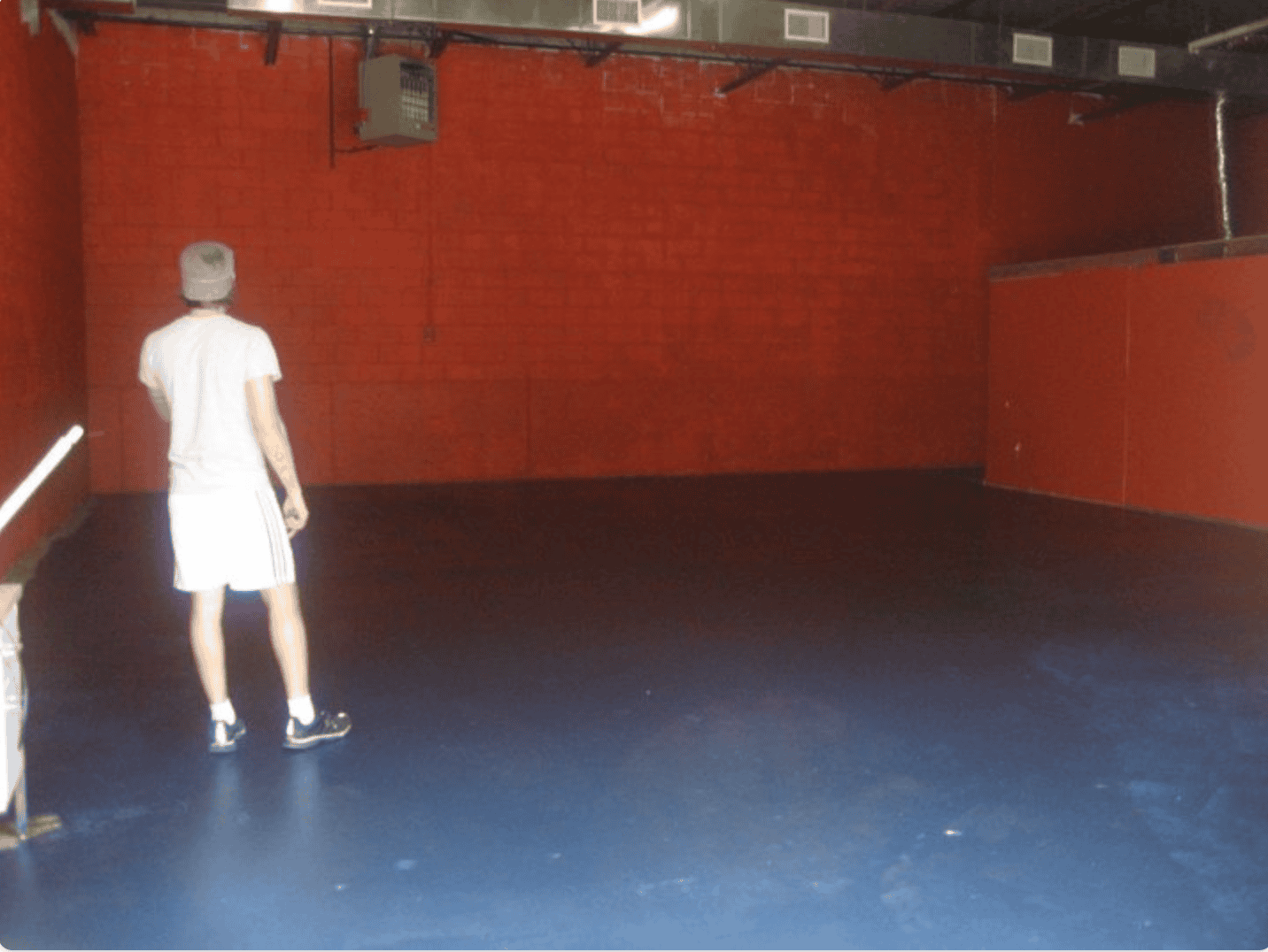 Pastor Johnny standing alone in the first ever warehouse church a week before launch
